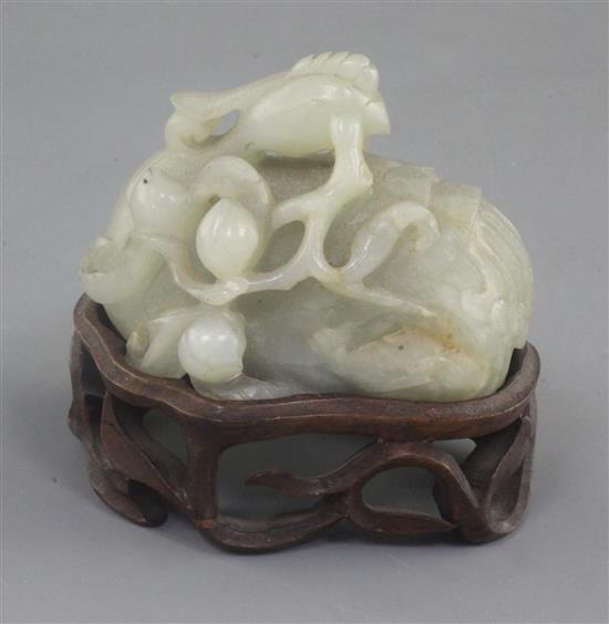 A Chinese celadon jade scroll weight, 17th / 18th century, 7.5cm, later wood stand